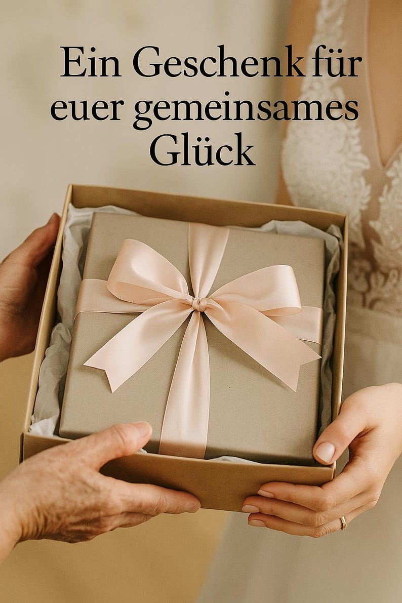 May include: A gift box with a light brown wrapping and a pale pink satin ribbon tied in a bow. The box is held open, revealing the wrapped present inside. Text in German is visible at the top of the image.