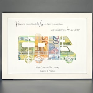 May include: A white framed print with a camper van silhouette made of euro bills. The text reads "Reisen ist der sch&ouml;nste Weg um Geld auszugeben und trotzdem reicher zu werden." and "Alles Gute zum Geburtstag! Sabine & Marcus".