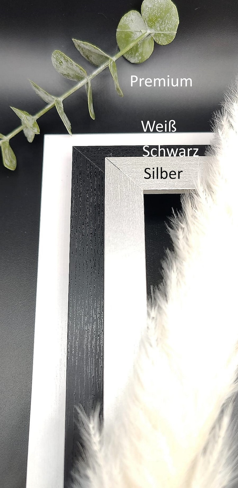 Puede incluir: Dos marcos de fotos, uno negro y otro plateado, con las palabras "Premium", "Wei&szlig;", "Schwarz" y "Silber" impresas en la parte delantera.