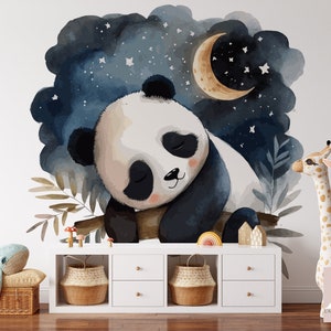 May include: A watercolor illustration of a sleeping panda bear with a crescent moon and stars in the background. The panda is sitting on a branch with leaves and mushrooms. The illustration is on a white background.
