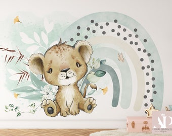 May include: A cute cartoon lion cub sitting in a field of green leaves and flowers. A blue, green, and beige rainbow with black polka dots is in the background.