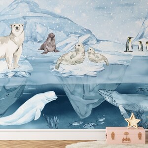 May include: Watercolor mural featuring arctic animals in a snowy landscape. A polar bear, walrus, seals, penguins, beluga whale, and humpback whale are depicted. The mural has a light blue and white color scheme with a whimsical style.