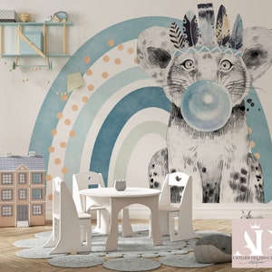May include: A white and gray animal with a blue bubble, wearing a headdress of feathers, is depicted on a blue and green rainbow background. The image also shows a white table and chairs in a room with a wooden floor.
