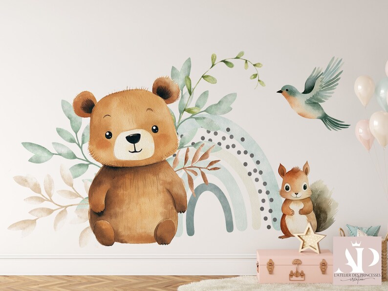May include: Watercolor wall decal featuring a brown bear, a squirrel, a blue bird, and a rainbow with a white background. The decal is perfect for a nursery or child's room.