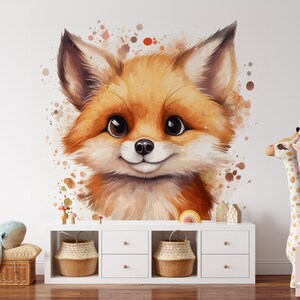 May include: A watercolor illustration of a cute fox with big brown eyes and a friendly smile. The fox is surrounded by watercolor splatters in shades of brown and orange. The illustration is perfect for a nursery or child's room.