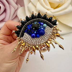 Broche mauvais œil en perles faite main : porte-bonheur protecteur