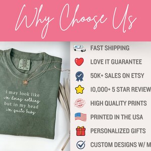 May include: A moss green t-shirt with the text "i may look like I'm doing nothing but in my head I'm quite busy." A gold necklace is draped on the shirt. The image also includes text that says "Why Choose Us".