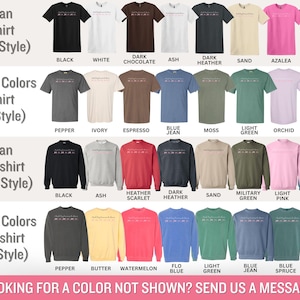 May include: A product display featuring various t-shirts and sweatshirts in multiple colors. The image showcases Gildan and Comfort Colors styles, including black, white, and heather grey. Text on the image reads "Looking for a color not shown? Send us a message!"