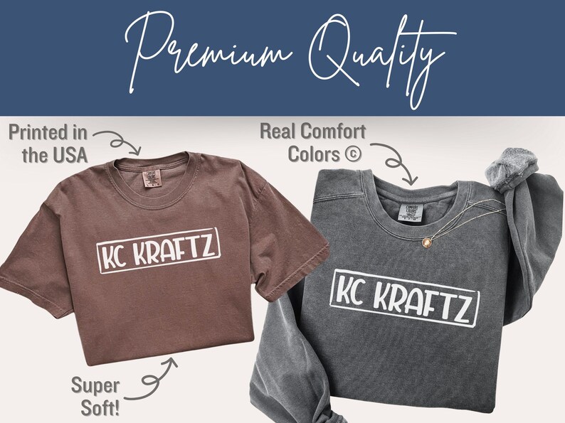 May include: Two t-shirts, one brown and one gray, with the text "KC KRAFTZ" in a white rectangle. The brown shirt is short-sleeved, and the gray shirt is long-sleeved. The image includes the text "Printed in the USA", "Real Comfort Colors", and "Super Soft!"