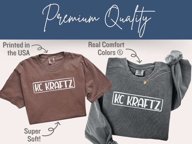May include: Two t-shirts, one brown and one gray, with the text "KC KRAFTZ" in a white rectangle. The brown shirt is short-sleeved, and the gray shirt is long-sleeved. Text in the image says "Printed in the USA", "Real Comfort Colors", and "Super Soft!"