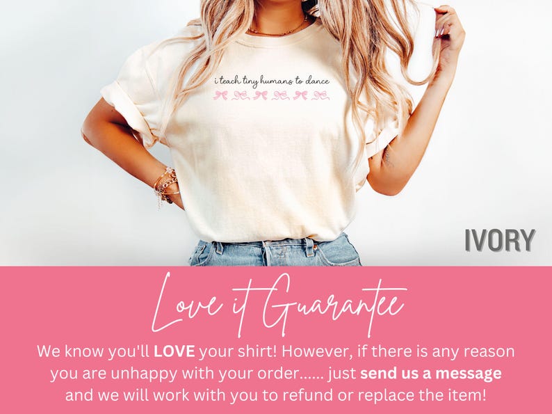 May include: Ivory-colored t-shirt with the text "i teach tiny humans to dance" in a script font. Below the text are pink bow graphics. The shirt is a casual style.