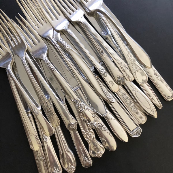 Mismatched / mixed patterns silver plated 12 knives and 12 forks. Antique and vintage ornated flatware / silverware set