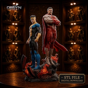 Op de afbeelding: Een gedetailleerd beeld met twee superheldenfiguren. Eén figuur draagt een zwart-blauw pak, de ander een rood-wit pak met een cape. De basis is een rotsachtig terrein met vurige accenten. De tekst "STL FILE + DIGITAL DOWNLOAD" is zichtbaar.