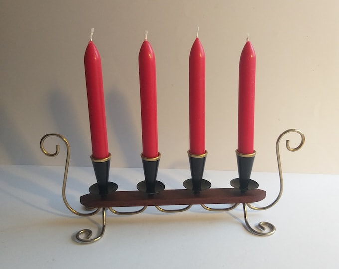 Swedish Metal Candleholder for Four Candles. Painted in Black Colour. Brass Top. Teak Base. Gunnar Ander. MCM Design. Reminds Viking Shipp.