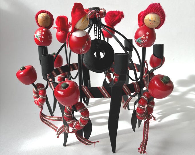 Vintage Swedish Toarpskrona Christmas Candelabra. Black wrought Iron and hand-painted wooden red-hatted Figures with Miniature Red Apples.