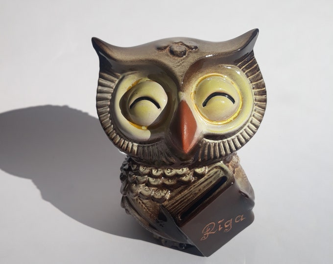Vintage Ceramic Owl with Lovely Face. She Holds a Book with the Inscription Riga. Created in the Baltic State - Latvia. Ceramics of the 80s.