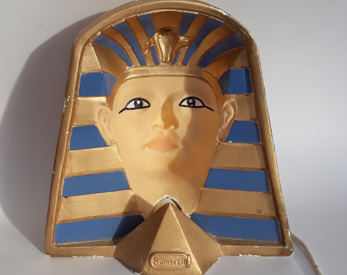 Cool looking Pharaoh Ramses' Headlamp made of Plaster. The Pharaoh's Eye Gaze accompanies from all Angles. Hand Painted. Used.