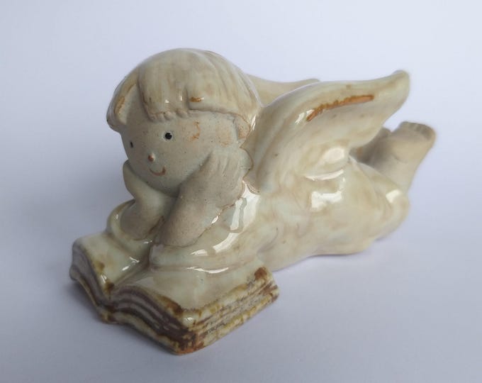 Studio Pottery Ceramic Angel, Cupid thoughtfully reading a Book. Beige Glaze. Art Pottery. Lovely Home Decoration.