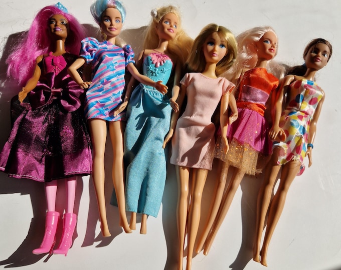 Lot of 6 Vintage Barbie Dolls.