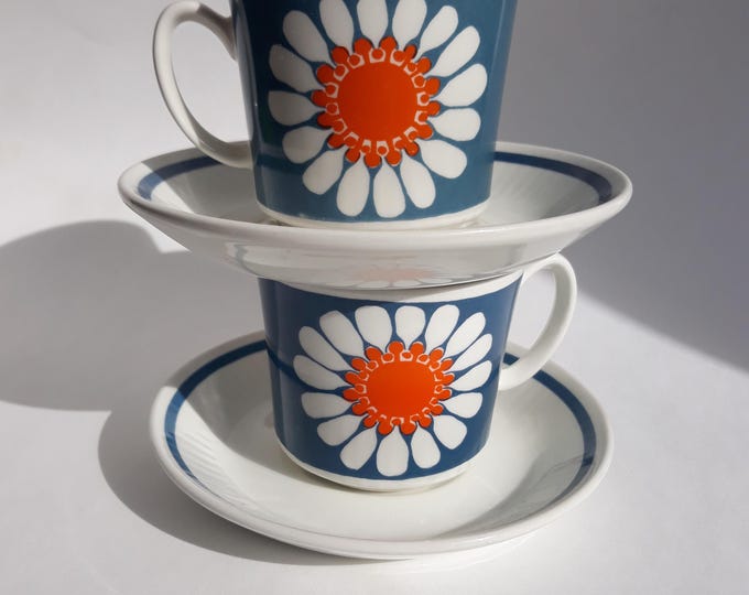 One Figgjo Flint Norway Daisy Tea, Coffee Cup with Saucer. Design by Turi Gramstad Oliver. Blue, Orange, White Colours. Stylized Flower.