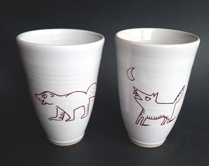 Set of Two Studio Pottery Ceramic Cups in White Colour. Hand Painted Stylized Animal Drawings on One Side. Artist Signed. Vintage Pottery.