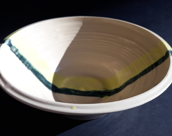 Studio Handmade Ceramic Bowl in Cream White Colour. Decorated with Yellow and Greenish Grey Stripes. Nice Shape. Good Size. Artist Signed.