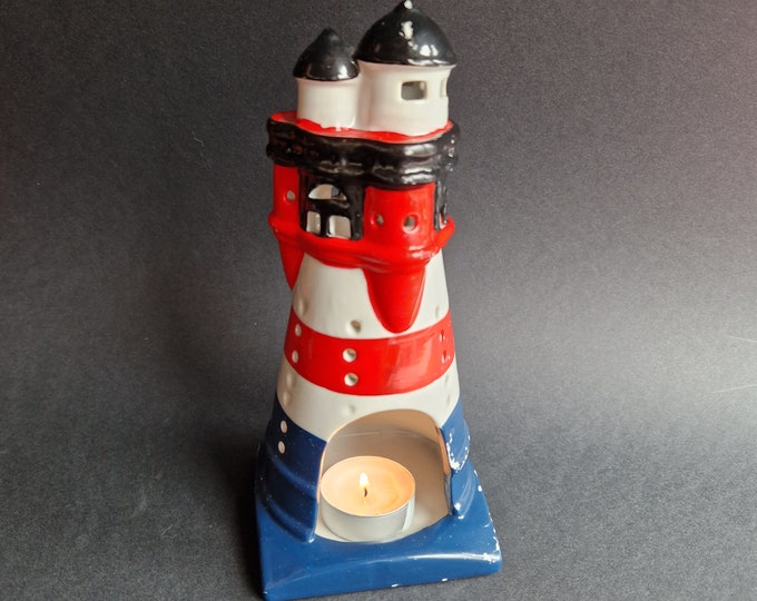 Vintage Ceramic Lighthouse Tea Candleholder in Expressive Colours. Colour is missing in Places. Looks like it got hit by a Storm. Still Cool