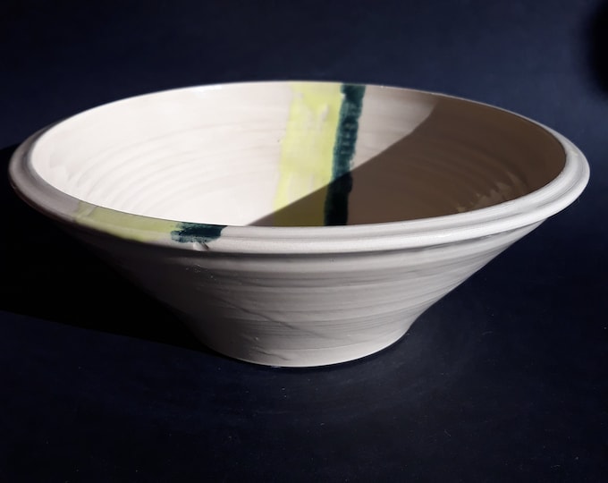 Studio Handmade Ceramic Bowl in Cream White Colour. Decorated with Yellow and Greenish Grey Stripes. Nice Shape. Good Size. Artist Signed.