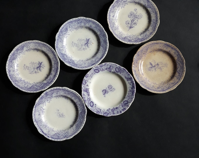 Set of 6 Antique Butter Sweden Plates. Marked on Back. Purple Decor around the Edge. Different Flowers in the Center. Rare Find.