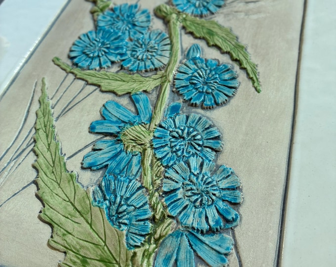 One Jie Gantofta Sweden Ceramic Wall Hanging, Plaque. Design Aimo Nietosvuori. White Glazed Rim, Ivory Matt Base, Blue Flowers Relief.
