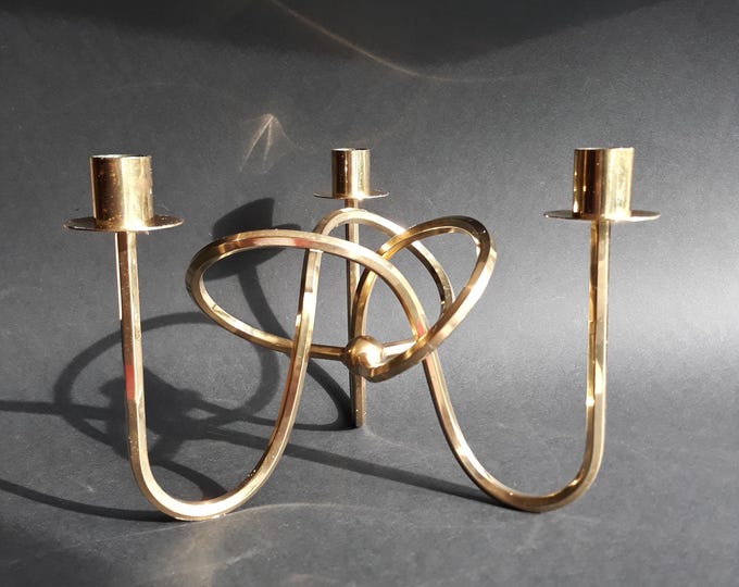 The Knot of Friendship Brass Candle Holder Designed by Josef Frank for Svenskt Tenn in Sweden. Elegant Design. Flowing Lines forming a Knot.