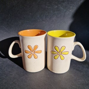 Two Simple Floral Design Beige Stoneware Mugs with Interesting Shape Handles. Happy Colours Yellow and Orange Glaze Inside. Retro Tableware.