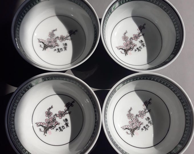 Set of 4 Vintage Oriental Rice Soup Bowls on Small Foot with Pink Cherry Blossom Motif and decorated Rim. Marked.