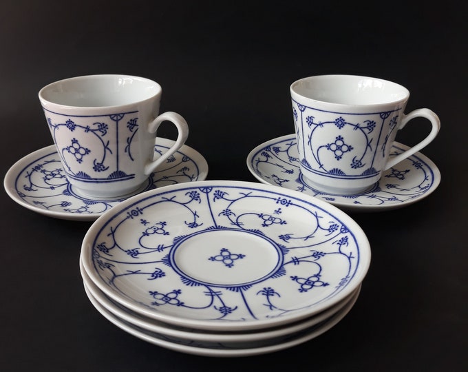 A Pair of Vintage Jäger Eisenberg Germany 'Blau Saks' Porcelain Tea Coffee Cup and Saucer with a Strawflower Pattern in Indian Blue. GDR.