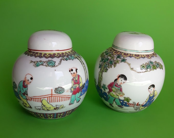 Set of 2 Cute Colourful Oriental Ginger Jars with Lids. Lidded Jars are depicting Children feeding Birds under Trees. Made in China 70s.