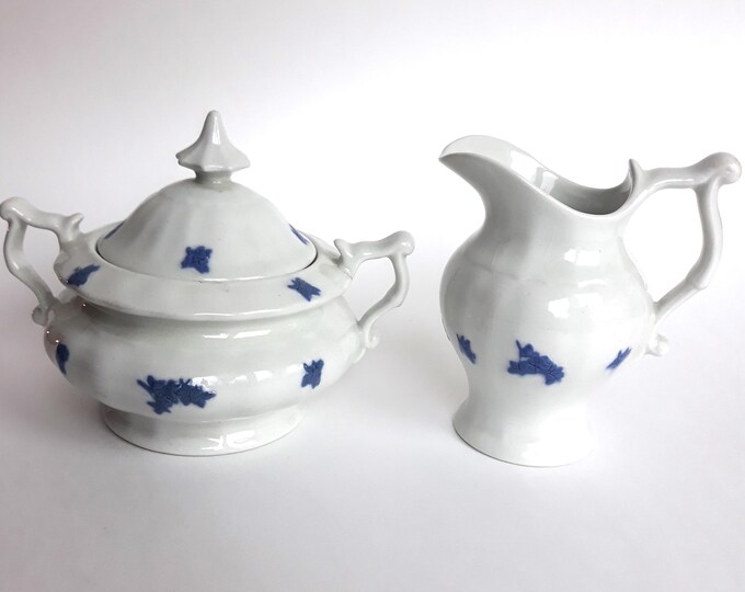 Vintage Sugar and Creamer Set in Bla Blom Pattern. White Base with Relief Blue Flower Relief. Marked with MZ.