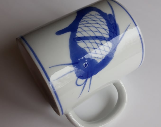 Adorable Hand Painted Vintage Chinese Porcelain Mug with a Blue Koi Karp Fish Decoration on the Sides. Marked. Good Vintage Condition.