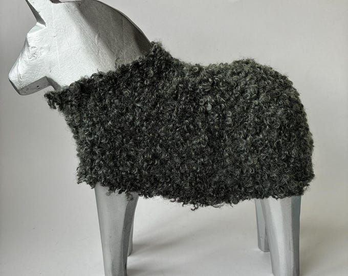 Vintage Ikea Stolle Dala Horse designed by Katarina Brieditis (2001/2002). Angular Carved Silver Wooden Body with a Curly Wool Saddle Cover.