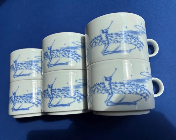 One Set of 2 or 4 Porcelain Mugs. Golf-themed Coffee or Tee Mugs. White with a blue Design. Golfer in action.