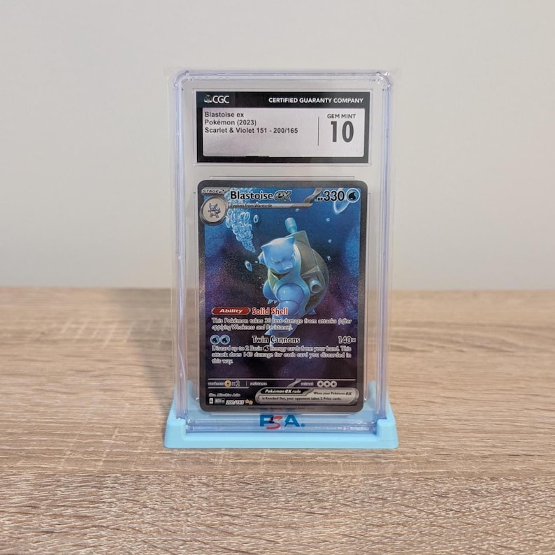 May include: A graded Pok&eacute;mon card featuring Blastoise ex from the Scarlet & Violet 151 set. The card is encased in a protective holder with a Gem Mint 10 grade. The card has a blue and white color scheme, with the Blastoise character in the center.