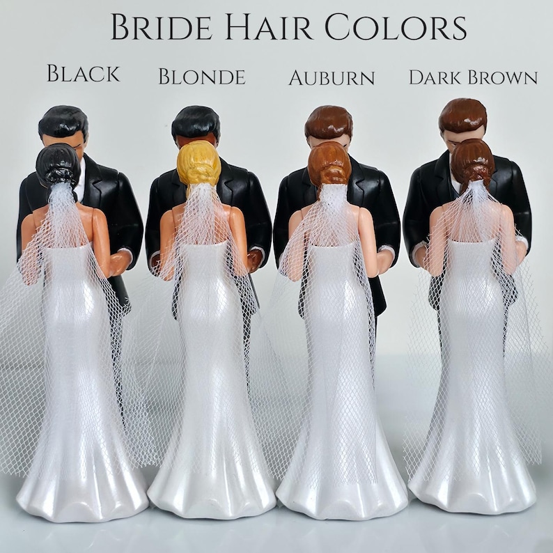 May include: Wedding cake toppers featuring a bride and groom. The brides have different hair colors: black, blonde, auburn, and dark brown. The brides wear white wedding dresses and veils, and the grooms wear black tuxedos. The text "Bride Hair Colors" is at the top.