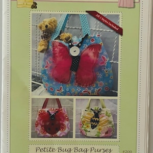 May include: A printed advertisement for "Curby's Closet" featuring three styles of "Petite Bug Bag Purses" for toddlers and little girls. The main image shows a blue bag with a red butterfly design. The text "All 3 Styles Included" is visible.