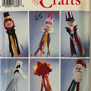 May include: A Simplicity Crafts sewing pattern for making six different windsocks. The pattern includes a leprechaun, a bunny, Uncle Sam, a ghost, a flower, and Santa Claus. The pattern number is 8156 and is one size.