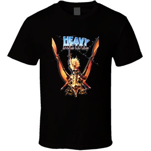 May include: Black t-shirt featuring a graphic of a woman riding a winged creature. The text "Heavy Metal" is above the graphic.