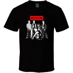 May include: Black t-shirt with a white graphic of a band called "Halestorm". The graphic features four people, including a woman with a microphone, standing in front of a speaker.