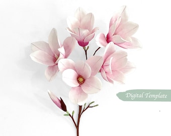 May include: A bouquet of delicate pink magnolia flowers with a single bud on a brown stem. The flowers have a soft, layered texture and are arranged in a cluster.