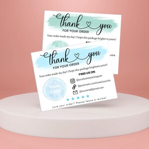 May include: Thank you card with a blue and green watercolor background. The card says "Thank you for your order" and includes a logo placeholder, social media icons, and a review request.