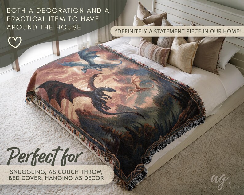 May include: A woven throw blanket featuring a fantasy dragon scene in shades of brown, blue, and red. The blanket is fringed and displayed on a bed with white linens. Text on the image reads, "Definitely a statement piece in our home."