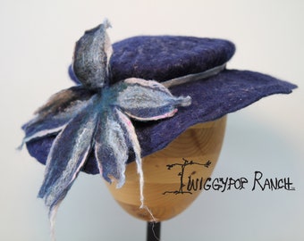 Dark blue hand felted flat hat with silver ribbon and attached felted flower