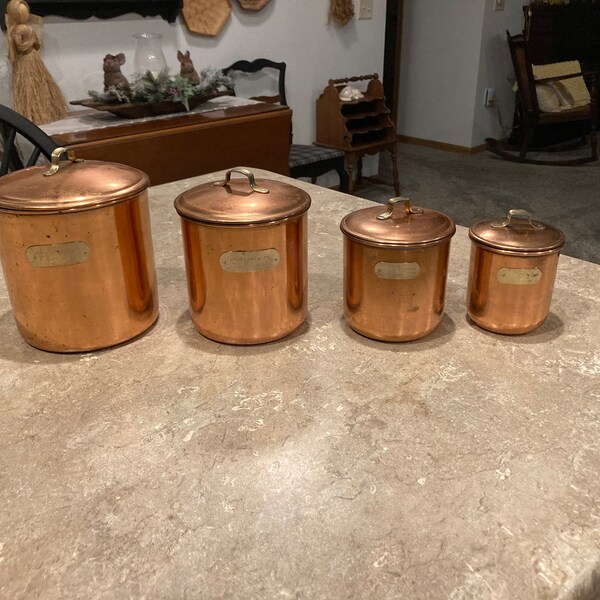 Vintage 4 piece copper/brass/metal canisters